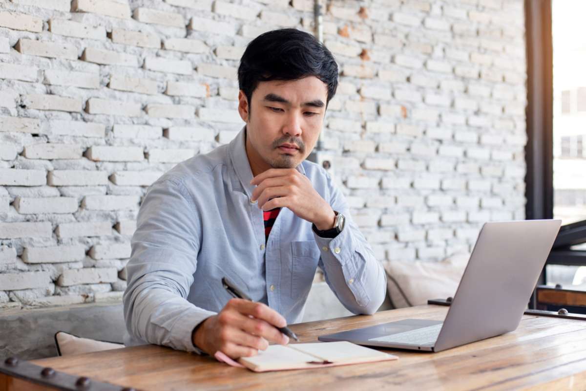 asian man work using computer hand typing laptop keyboard contact us