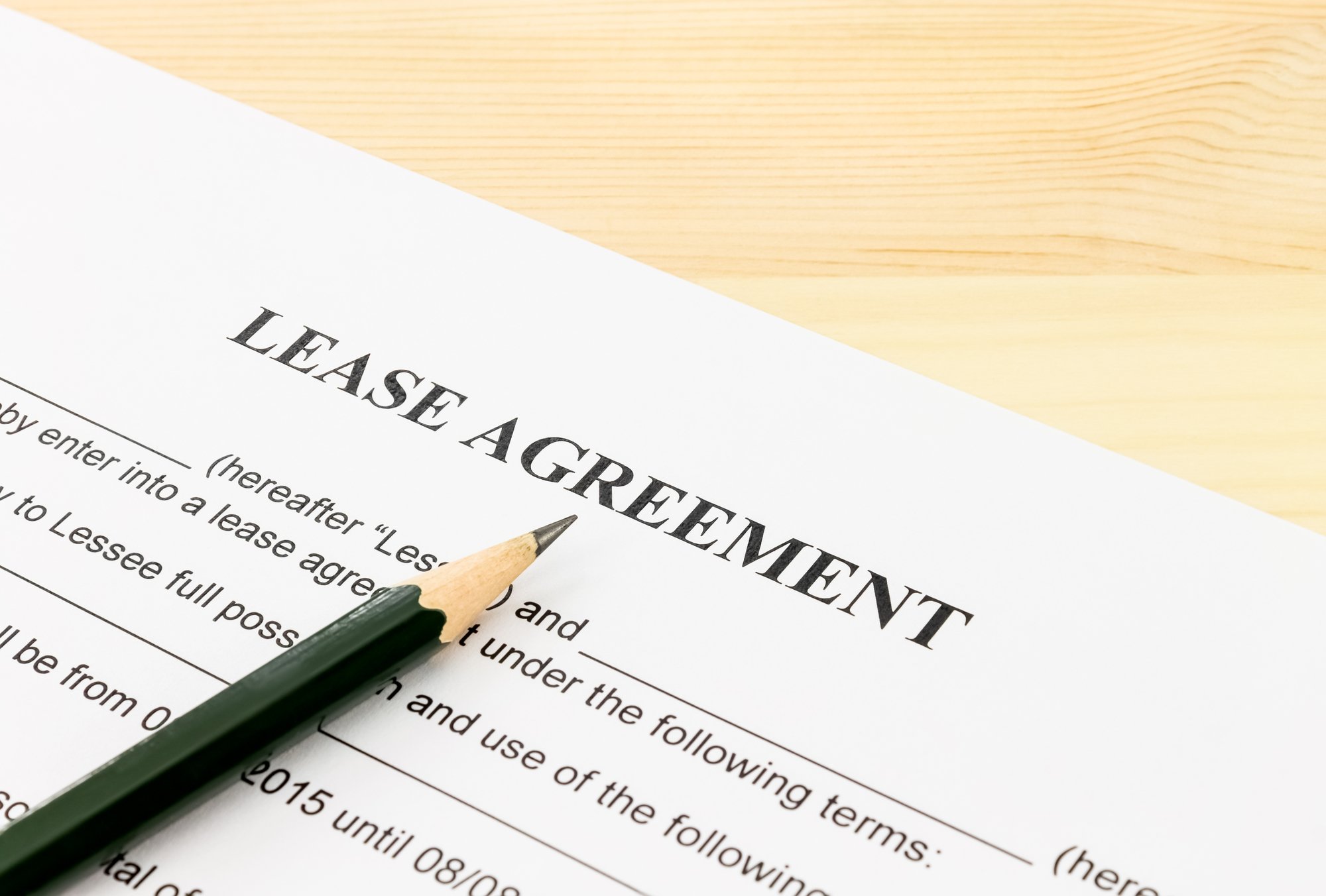 Lease Agreement Contract Document and Pencil Bottom Left Corner